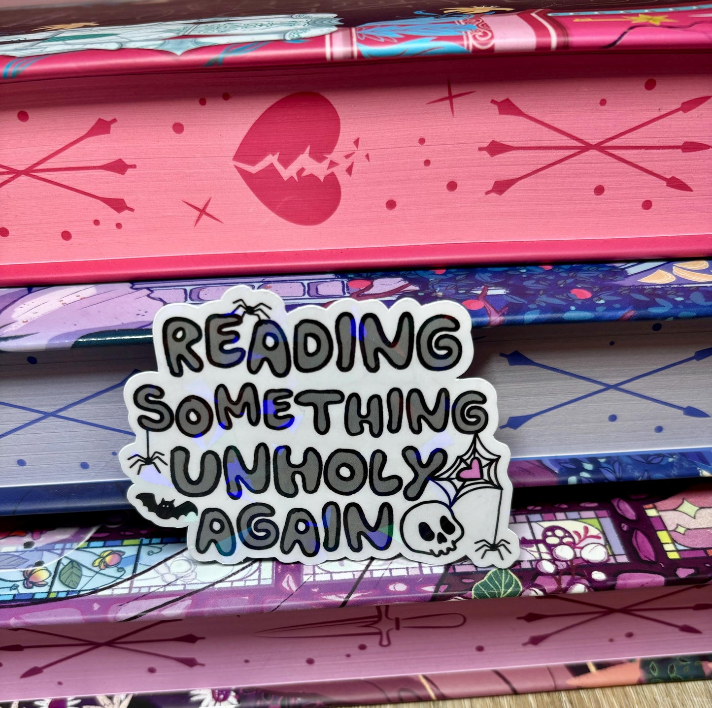 Reading Something Unholy Again Sticker